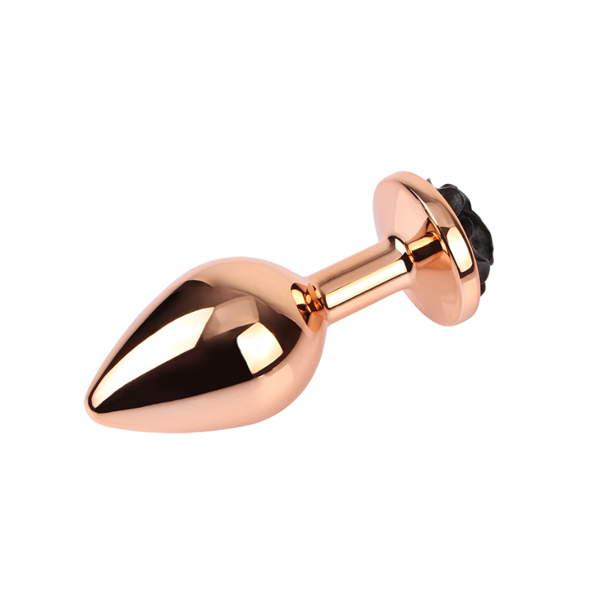 plug anal de metal dorado con gema rosa